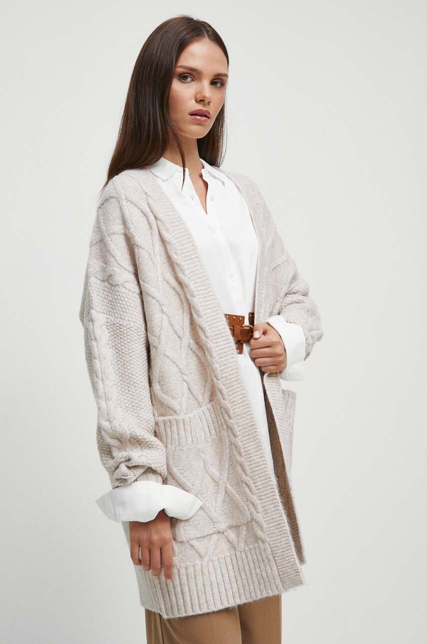 Toată lumea poartă cardigane lungi chiar acum și știm exact de ce cardigane