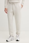 Under Armour spodnie dresowe męskie z bawełną Essential Fleece beżowe regular waist 1373882