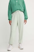 Bavlněné tepláky adidas Essentials zelená barva, IY4236