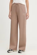 Tepláky Guess OCTAVIA dámské, béžová barva, s aplikací, V5BB12 KCX22