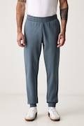 Puma spodnie dresowe męskie z bawełną Essential Logo niebieskie regular waist 682607