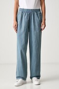 Puma jeansy relaxed fit damskie FUTURE PUMA ARCHIVE turkusowe 638361