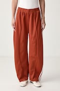 adidas Originals spodnie dresowe damskie Firebird Barrel pomarańczowe regular waist LF1062