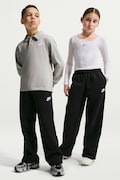 Nike spodnie dresowe dziecięce z bawełną Nike Sportswear czarne regular waist IM5095