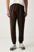 The North Face spodnie dresowe męskie z bawełną Evolution brązowe regular waist NF0A8CWYNMF1