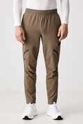 Under Armour spodnie dresowe męskie Unstoppable zielone regular waist 1390256.219