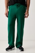 Under Armour spodnie dresowe męskie z bawełną Rival zielone regular waist 6013444