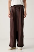 Puma spodnie dresowe damskie Piping Relaxed Woven brązowe high waist 634559