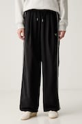 Puma spodnie dresowe damskie Piping Relaxed Woven czarne high waist 634559