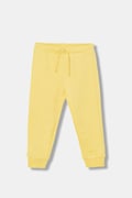 United Colors of Benetton spodnie dresowe bawełniane dziecięce kolor żółty z nadrukiem 3J70GF010