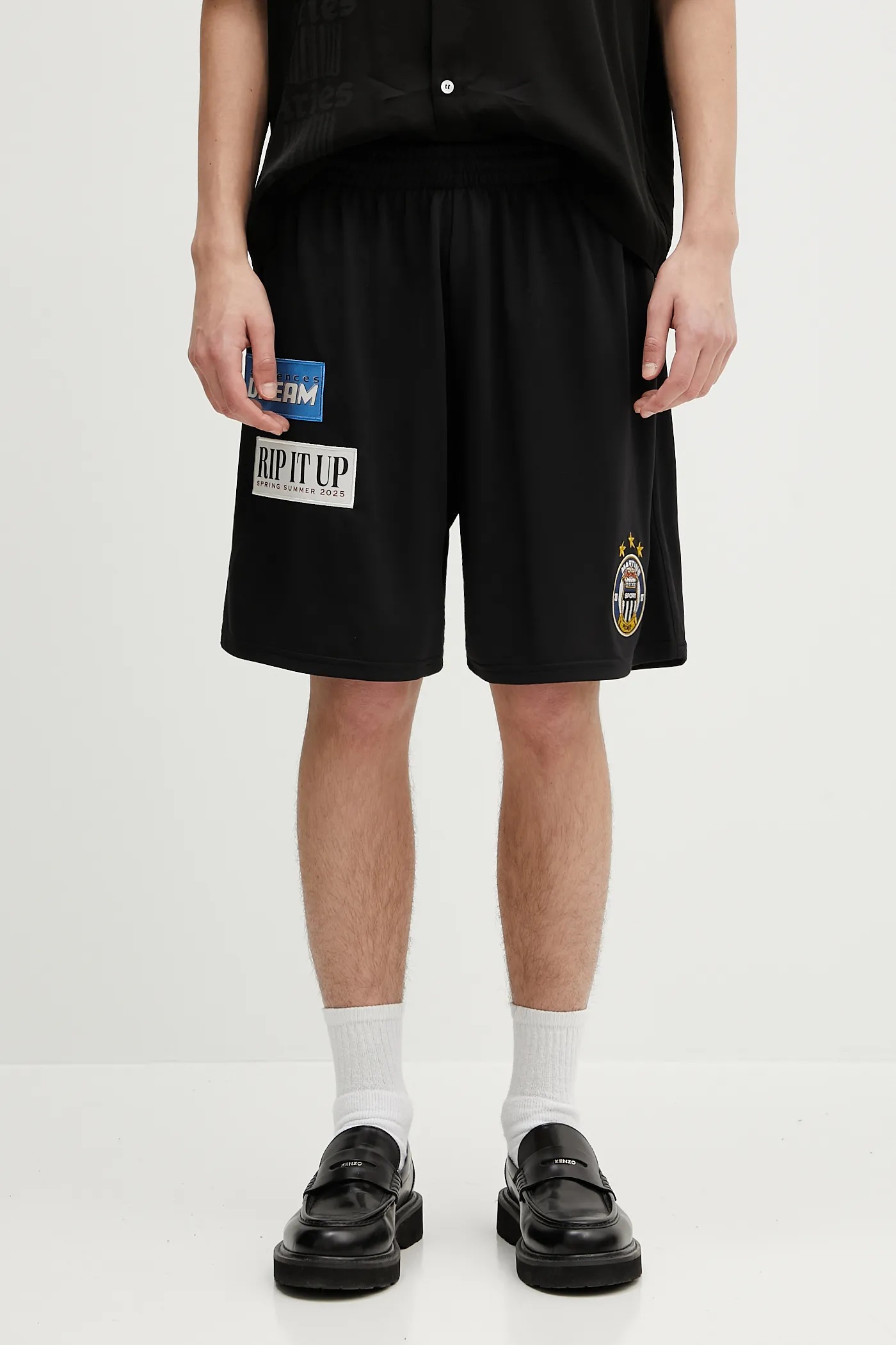 Martine Rose shorts Football black color with an application