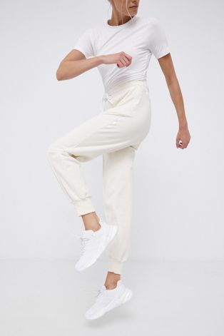 Штани adidas Performance жіночі колір кремовий з принтом