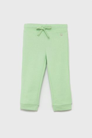 Дитячі бавовняні штани United Colors of Benetton колір зелений гладке