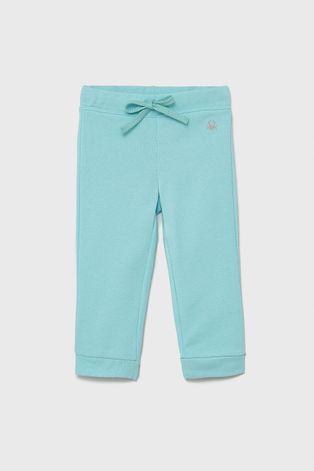 Дитячі бавовняні штани United Colors of Benetton колір бірюзовий гладке