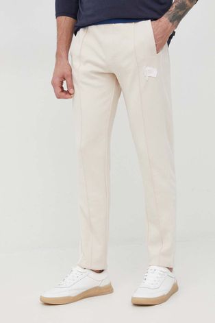 Tommy Hilfiger spodnie dresowe męskie kolor beżowy z aplikacją