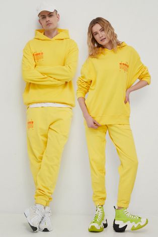 Diadora spodnie bawełniane kolor żółty z nadrukiem