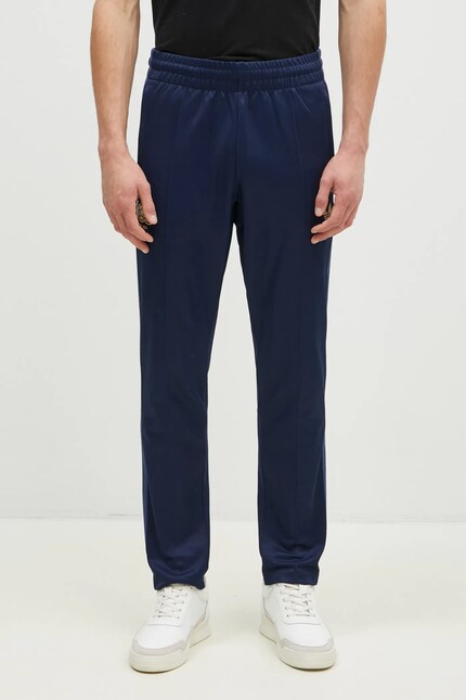 adidas joggers Anniversary Track Pant navy blue color with an