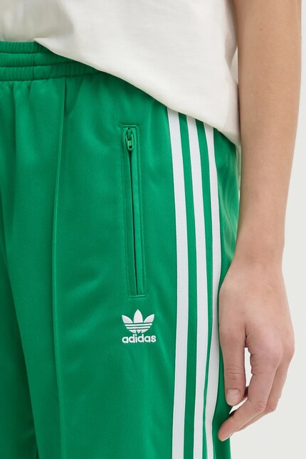 Спортивные штаны adidas Originals Firebird женские цвет зелёный с