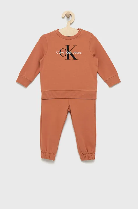 Otroška trenirka Calvin Klein Jeans oranžna barva