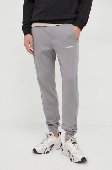 Tepláky Calvin Klein pánske,šedá farba,jednofarebné,K10K109940