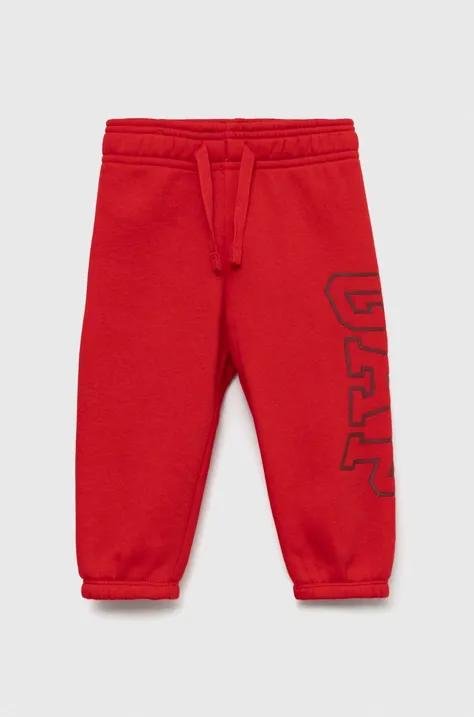 GAP spodnie dresowe dziecięce kolor czerwony z nadrukiem