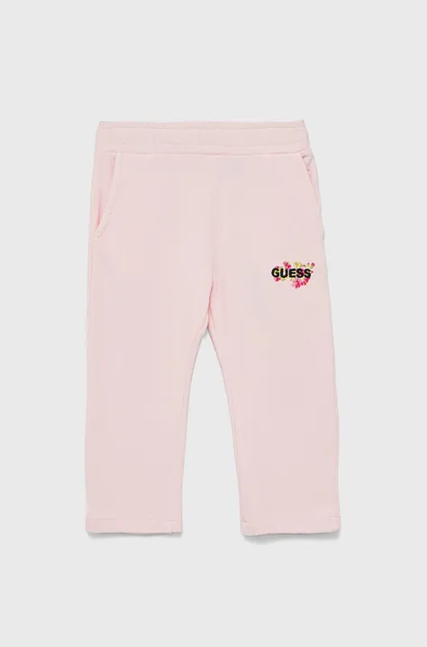 Guess spodnie dresowe bawełniane dziecięce kolor różowy z aplikacją
