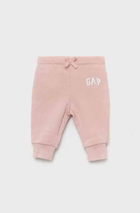 GAP spodnie dresowe dziecięce kolor różowy z nadrukiem