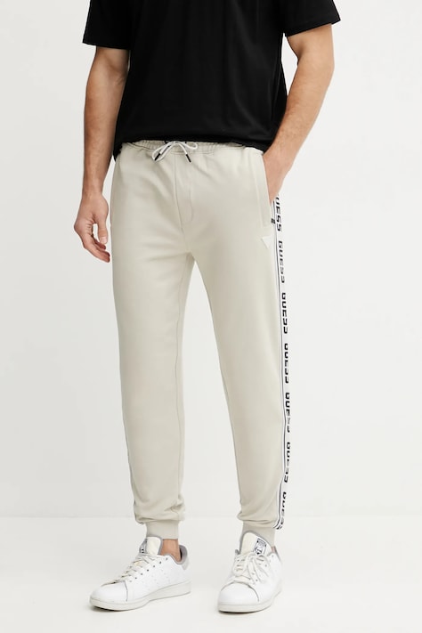 Guess pantaloni de trening culoarea bej, cu imprimeu