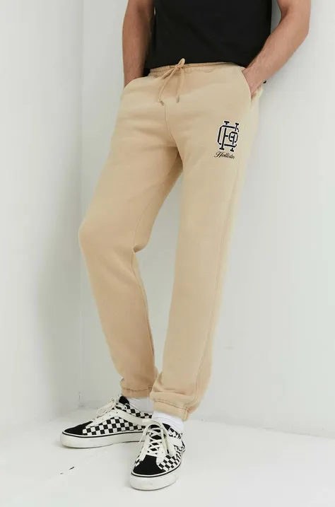 Hollister Co. spodnie dresowe męskie kolor beżowy z nadrukiem