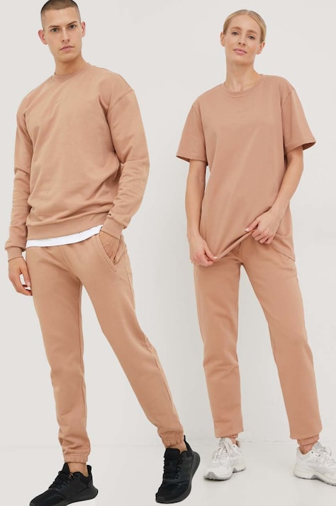 Arkk Copenhagen spodnie dresowe bawełniane unisex kolor beżowy gładkie