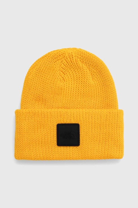 Шапка The North Face в оранжево от плътен трикотаж