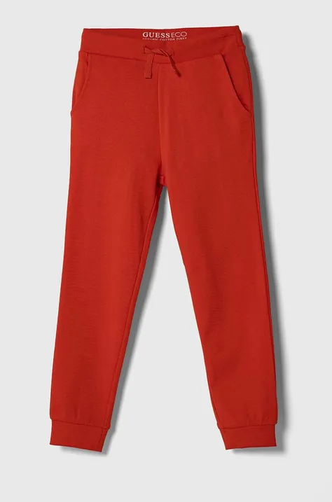 Дитячі бавовняні штани Guess колір червоний однотонні
