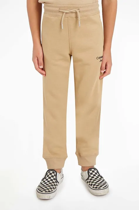 Calvin Klein Jeans pantaloni de trening pentru copii culoarea bej, neted