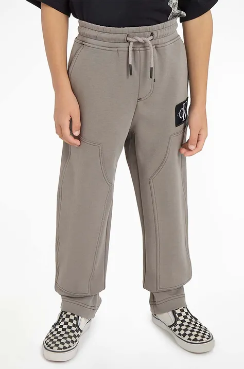 Calvin Klein Jeans pantaloni de trening pentru copii culoarea gri, neted