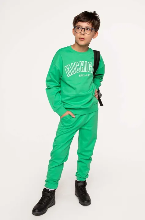 Дитячі бавовняні штани Coccodrillo колір зелений однотонні