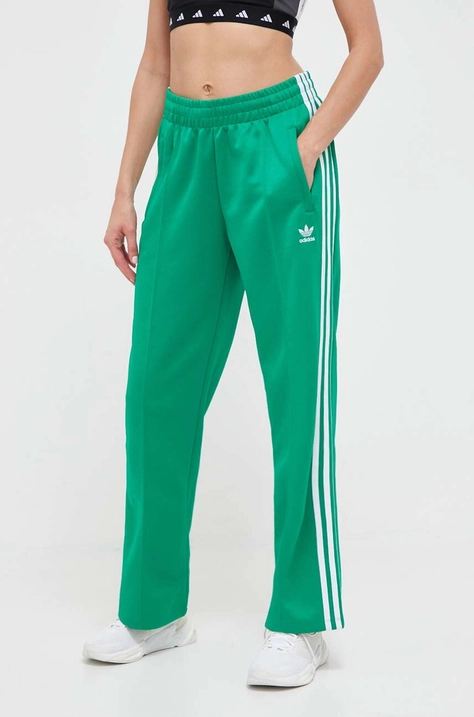 Tepláky adidas Originals zelená farba, s nášivkou