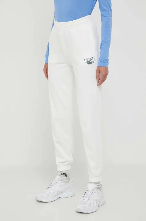 Спортивні штани Lacoste колір бежевий з принтом