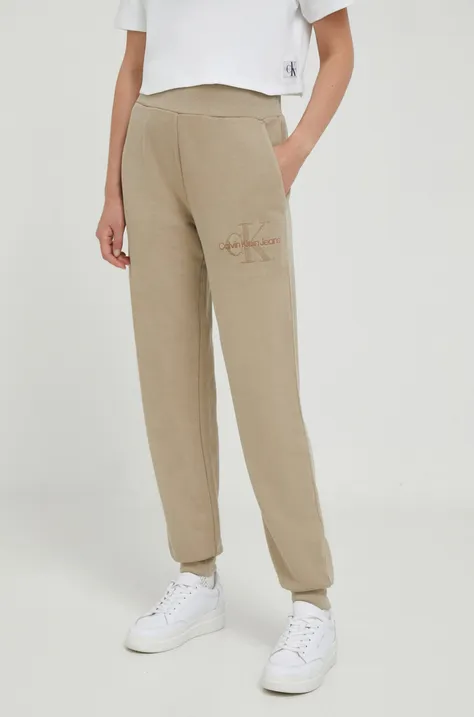 Calvin Klein Jeans pantaloni de trening din bumbac culoarea bej, neted