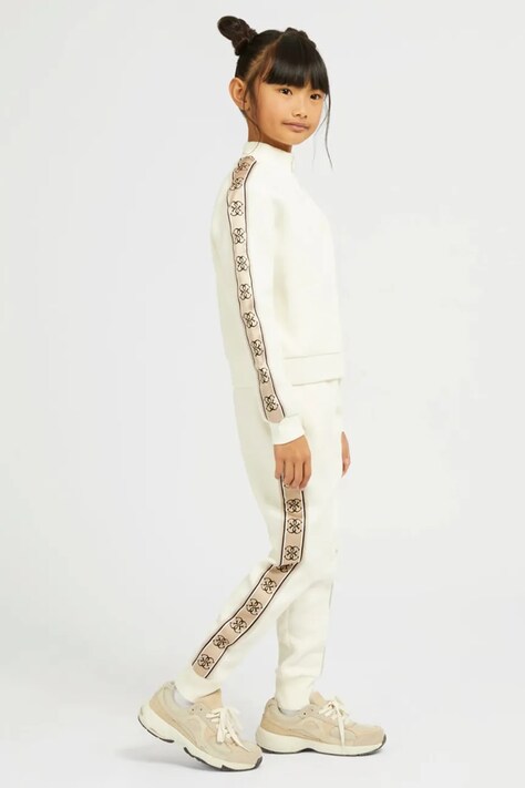 Dětské tepláky Guess béžová barva, vzorované