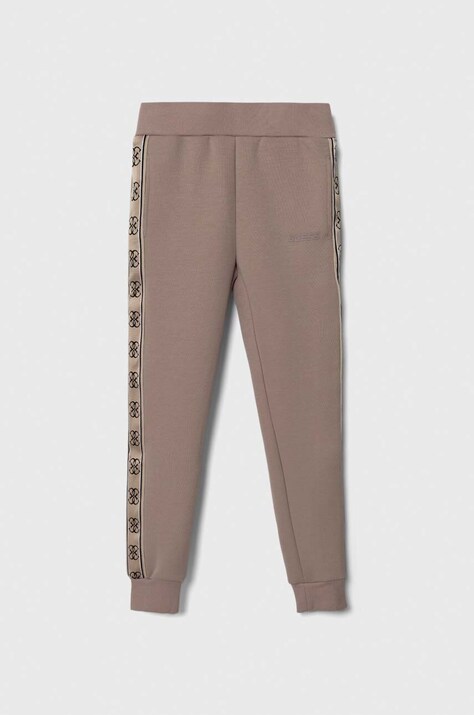 Dětské tepláky Guess hnědá barva, vzorované