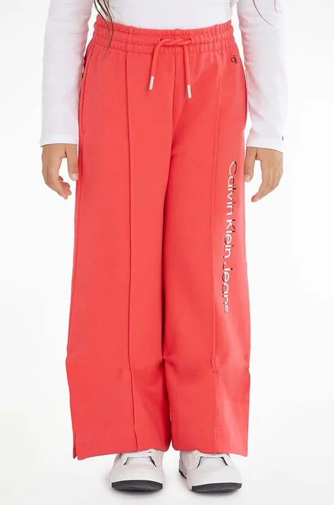 Dječji pamučni donji dio trenirke Calvin Klein Jeans boja: crvena, s tiskom
