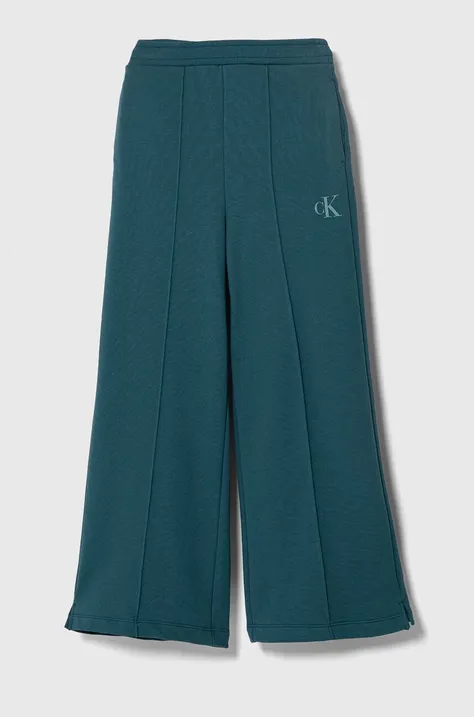 Calvin Klein Jeans spodnie dresowe dziecięce kolor turkusowy gładkie