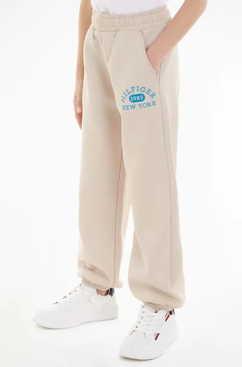 Дитячі спортивні штани Tommy Hilfiger колір бежевий однотонні