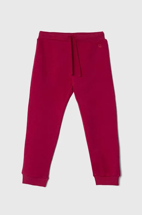 United Colors of Benetton spodnie dresowe dziecięce kolor różowy gładkie