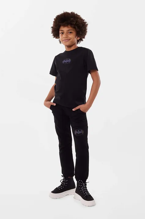 Dkny spodnie dresowe bawełniane dziecięce kolor czarny z nadrukiem
