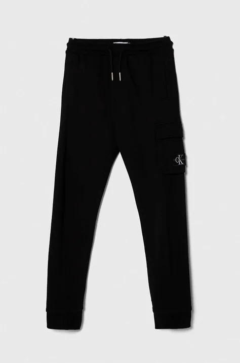Otroška bombažna trenirka Calvin Klein Jeans črna barva