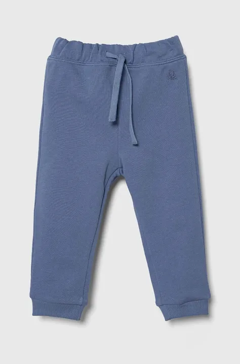United Colors of Benetton spodnie dresowe bawełniane dziecięce kolor niebieski gładkie