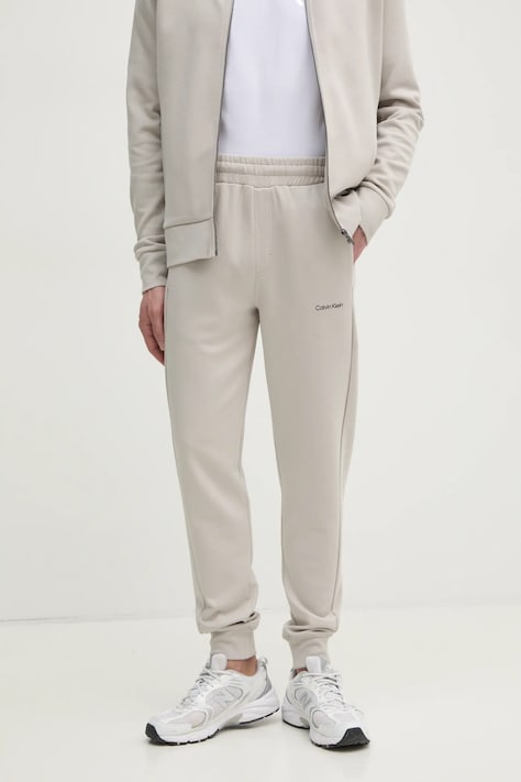 Calvin Klein pantaloni de trening culoarea bej, neted