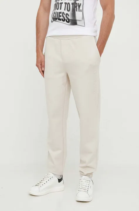 Calvin Klein pantaloni de trening culoarea bej, neted