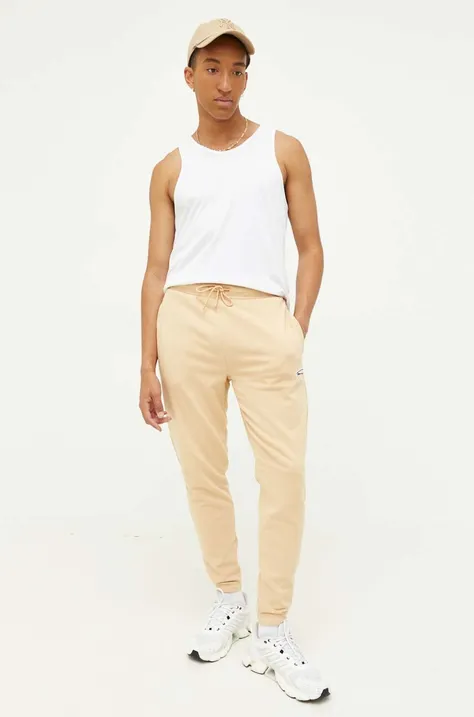 Tommy Jeans spodnie dresowe kolor beżowy z aplikacją